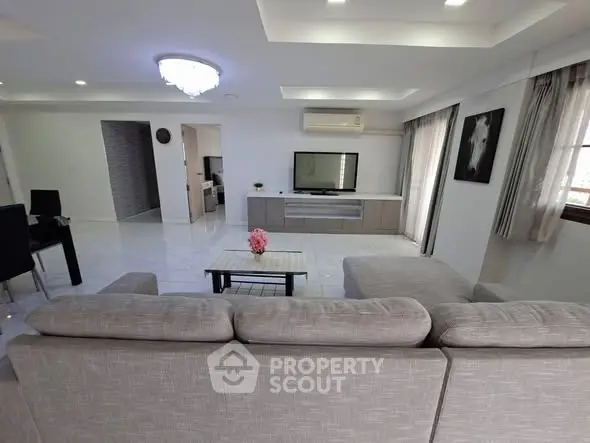 Spacious modern living room with elegant decor and ample natural light