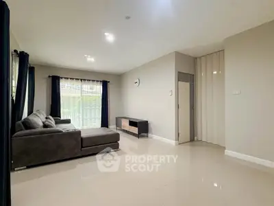 Spacious modern living room with sleek furniture and natural light