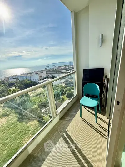 Stunning high-rise balcony with panoramic ocean views and modern design.