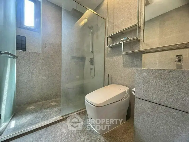 Modern bathroom with sleek design and glass shower enclosure