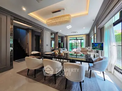 Luxurious dining room with elegant chandelier and modern decor in a spacious home