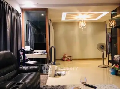 Spacious living room with modern decor and elegant lighting