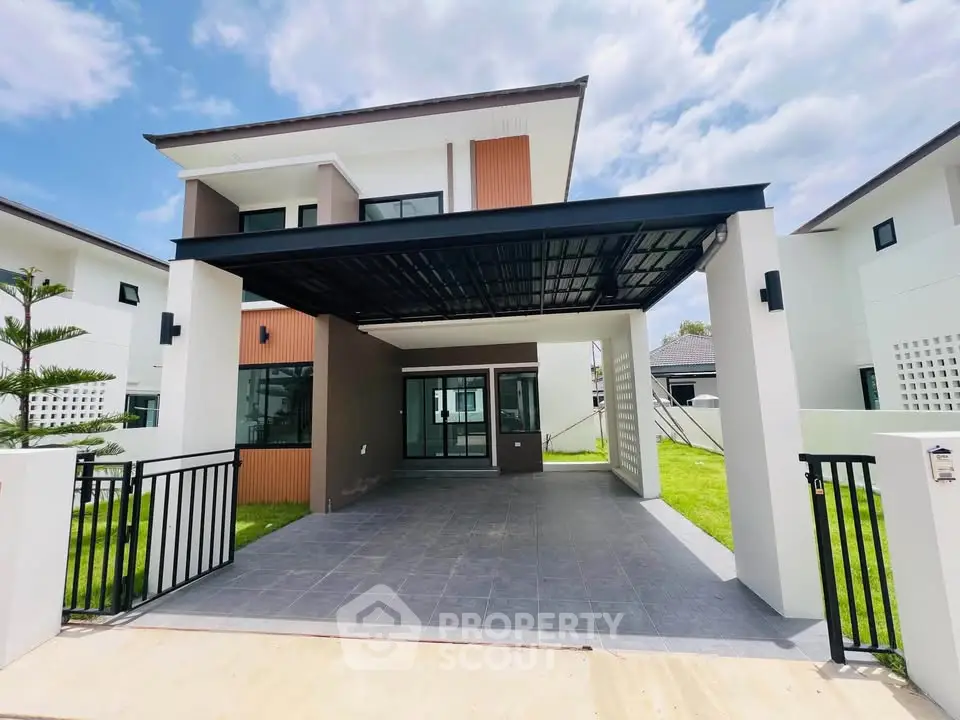 Modern two-story house with spacious carport and sleek design in a sunny neighborhood.