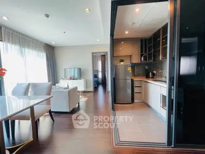 Spacious modern living room with open kitchen and elegant decor