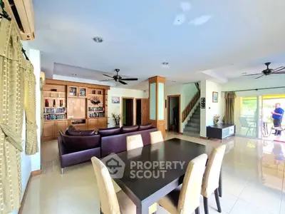 Spacious living room with modern furniture and open layout, perfect for family gatherings.