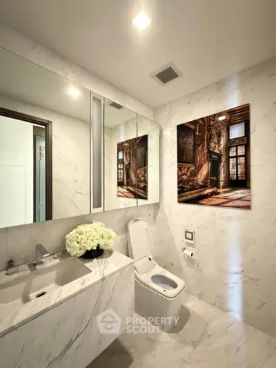Luxurious marble bathroom with modern fixtures and elegant decor