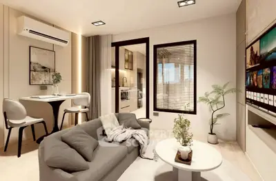 Modern living room with stylish decor and open layout, featuring a cozy sofa and wall-mounted TV.