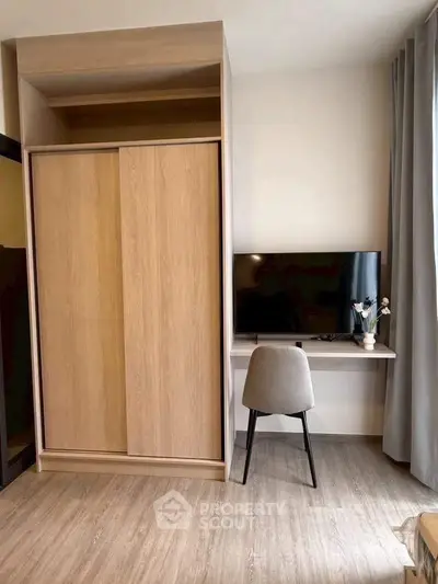 Modern bedroom with sleek wardrobe and stylish desk setup