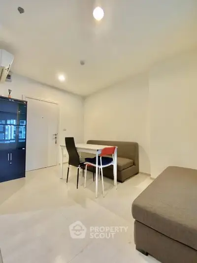Modern living room with sleek furniture and minimalist design, perfect for urban living.