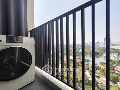 High-rise balcony with city view and modern washing machine