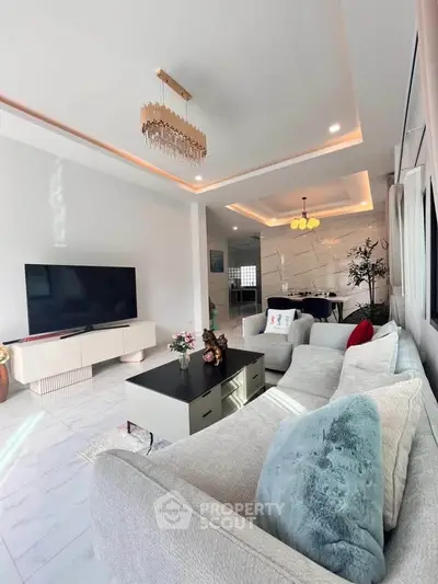 Luxurious living room with modern decor and elegant chandelier