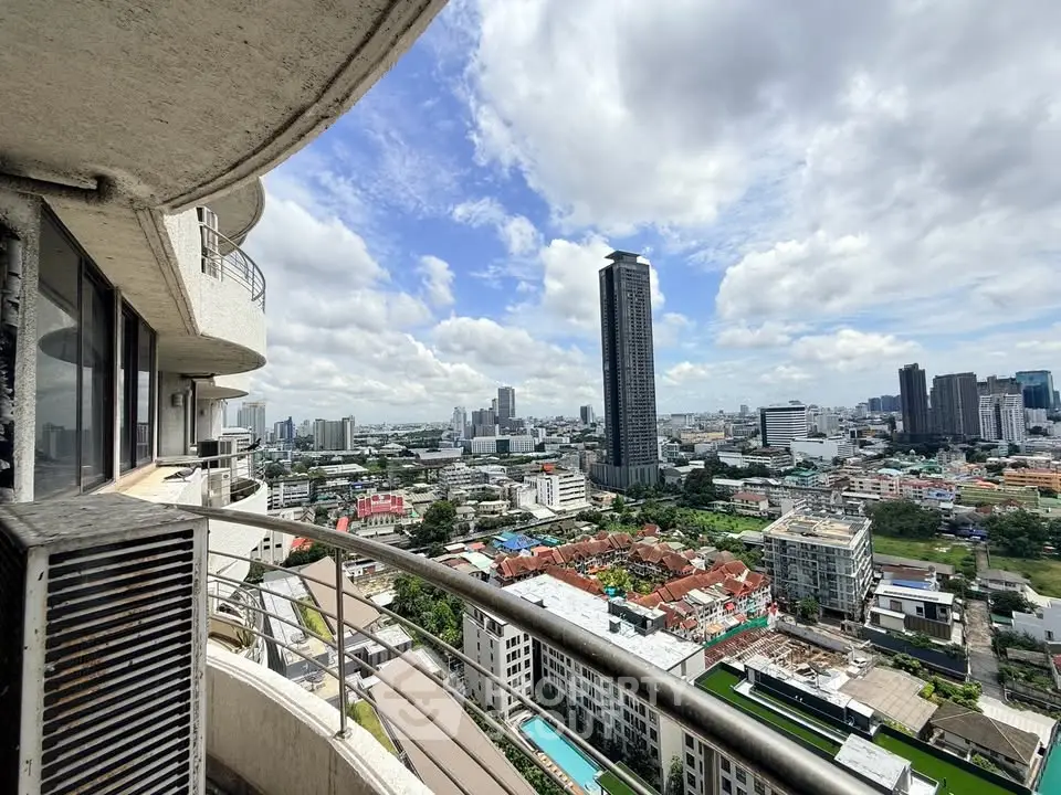 Stunning cityscape view from a high-rise balcony with modern architecture and vibrant skyline.