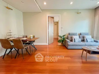 Spacious living room with modern furniture and wooden flooring