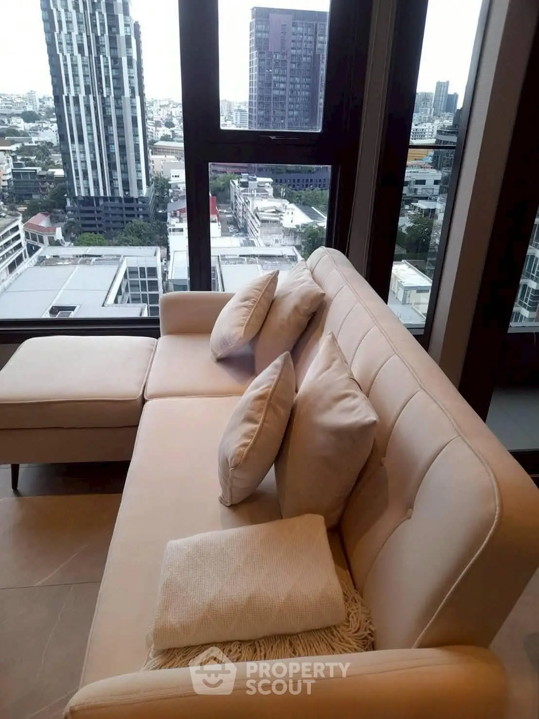 Luxurious living room with stunning city view from high-rise apartment