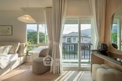 Bright living room with modern decor and balcony view in a stylish home