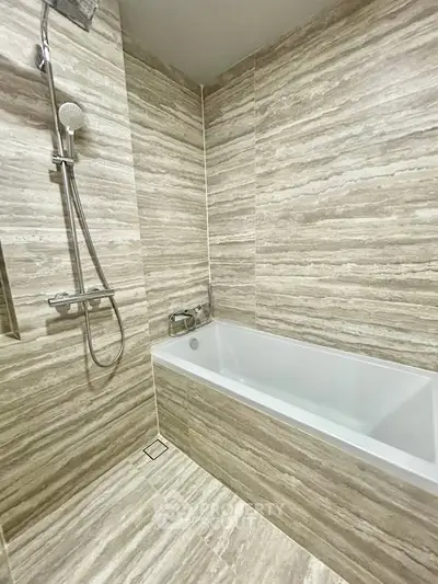 Luxurious bathroom with modern bathtub and elegant tile design