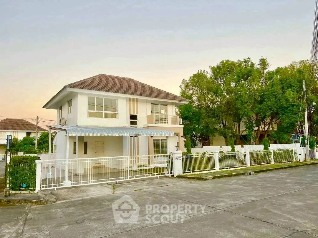 Charming two-story house with spacious yard and modern design in serene neighborhood.
