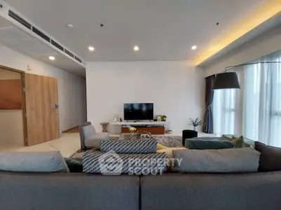 Spacious modern living room with cozy seating and stylish decor