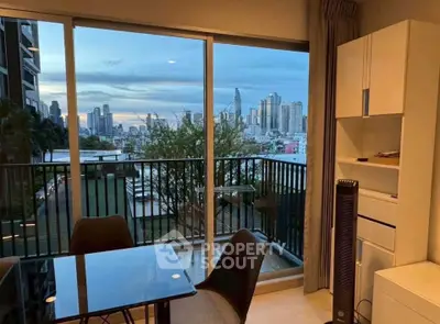 Modern apartment with stunning city view from balcony, featuring sleek dining area and stylish decor.