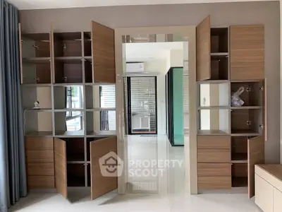 Modern interior with open wooden cabinets and sleek design