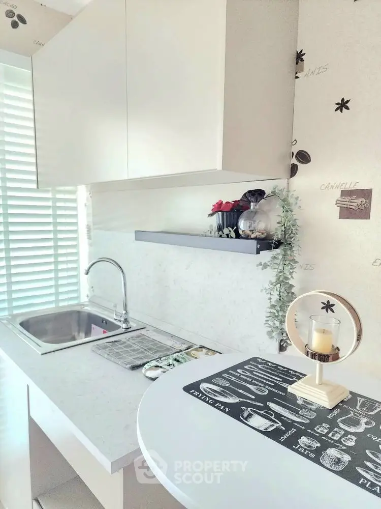 Modern kitchen with sleek white cabinets and stylish decor