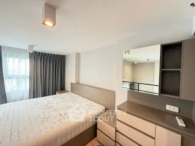 Modern bedroom with large window and stylish furniture in a high-rise apartment