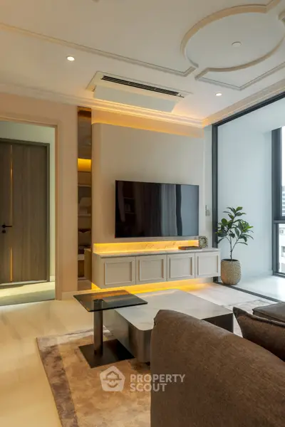 Luxurious modern living room with elegant decor and large TV