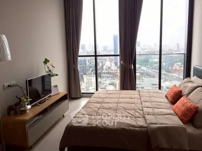 Modern bedroom with stunning city view and stylish decor