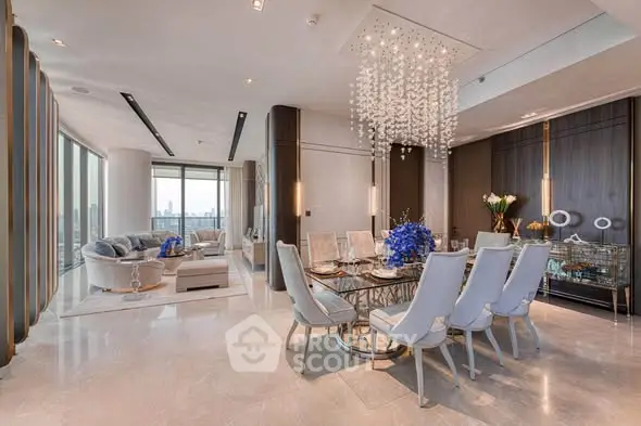 Luxurious open-plan living and dining area with elegant chandelier and panoramic city views.