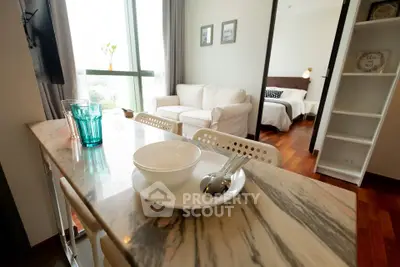 Chic open-plan living and dining area with modern decor and natural light