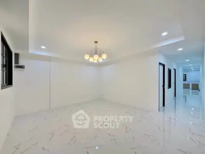 Spacious modern living room with elegant lighting and marble flooring