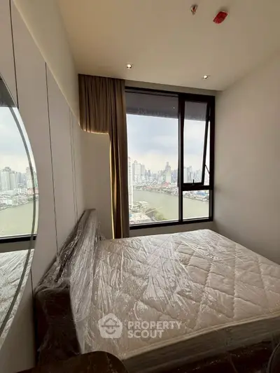 Modern bedroom with stunning city view and large window