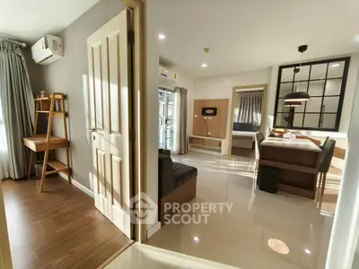 Modern open-plan living area with stylish decor and natural light