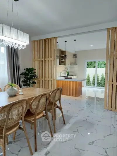 Elegant open-plan dining and kitchen area with modern design and natural light.