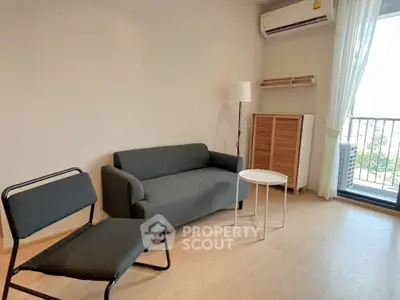 Modern living room with sleek furniture and balcony view