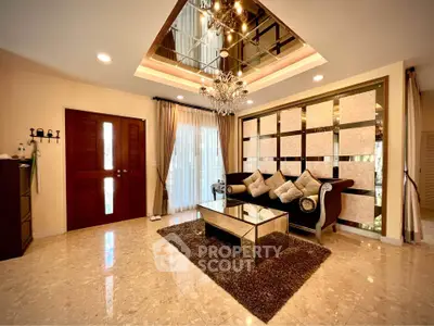 Luxurious living room with elegant chandelier and modern decor