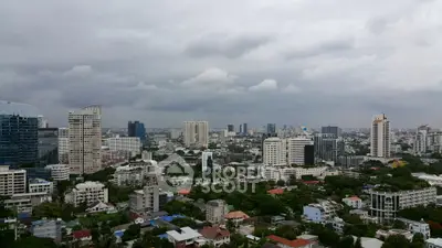 Stunning cityscape view showcasing a vibrant urban skyline with lush greenery and modern architecture.