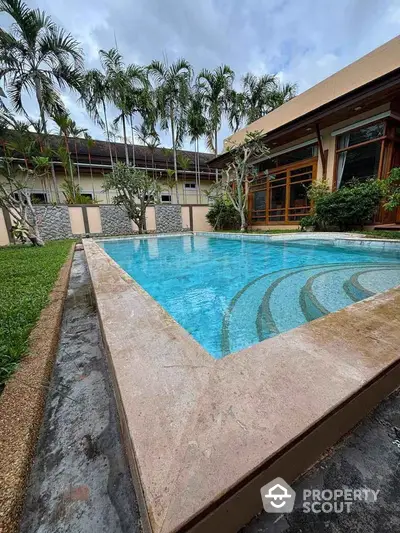 Luxurious villa with private pool and lush garden, perfect for relaxation and entertaining.