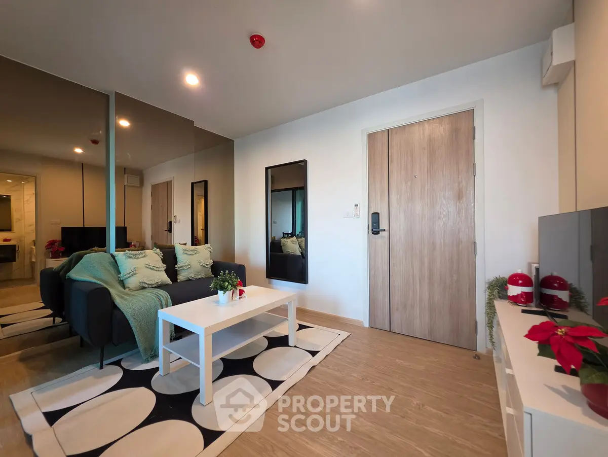 Modern living room with stylish decor and cozy seating area, perfect for relaxation and entertainment.