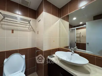 Modern bathroom with elegant fixtures and stylish tile design