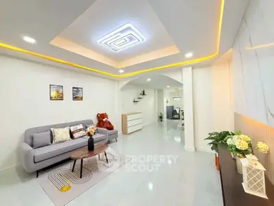 Spacious modern living room with elegant ceiling lights and stylish decor