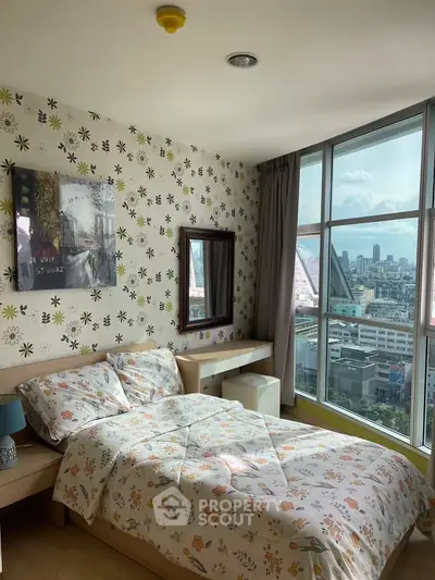 Charming bedroom with floral decor and stunning city view from large windows.