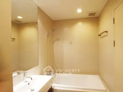 Modern bathroom with sleek design and built-in bathtub