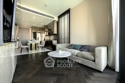 Modern living room with elegant decor and open kitchen layout