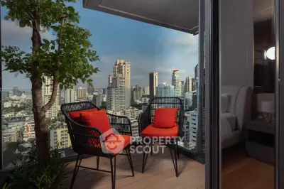 Stunning city view from a modern balcony with cozy seating and lush greenery.