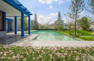 Luxurious modern home with stunning pool and landscaped garden