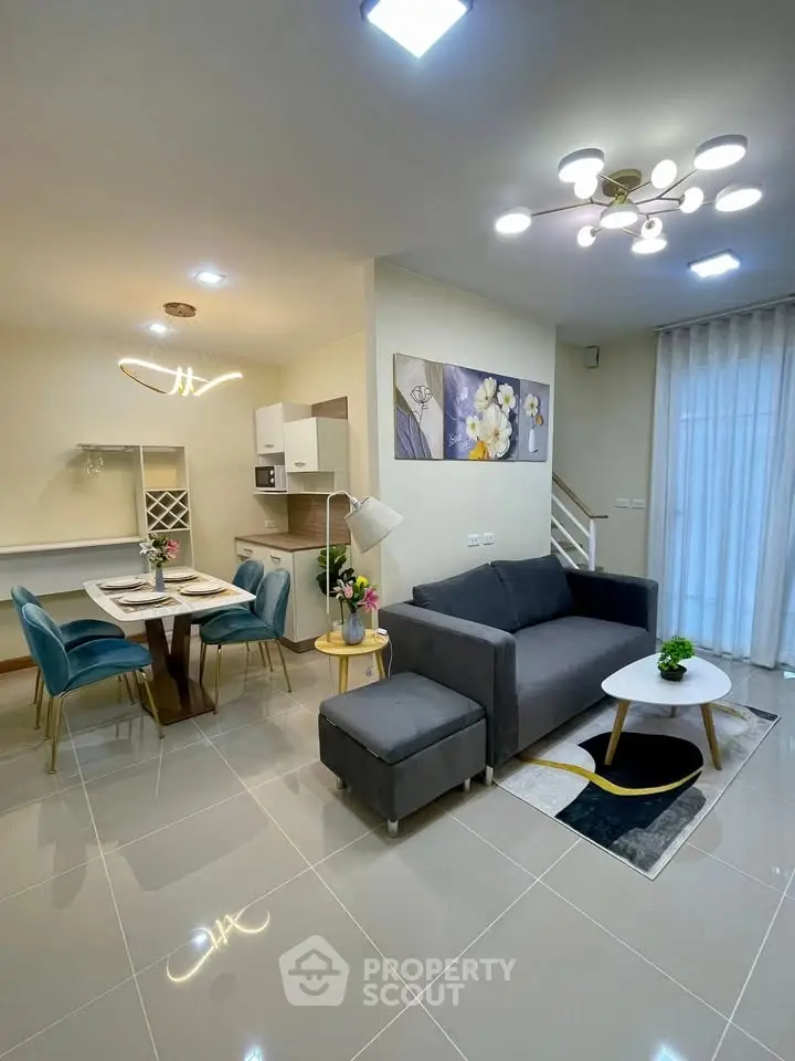Modern open-plan living room with stylish decor and dining area
