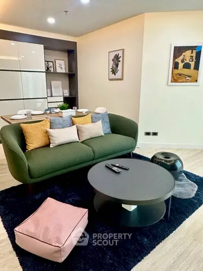 Stylish modern living room with cozy green sofa and chic decor