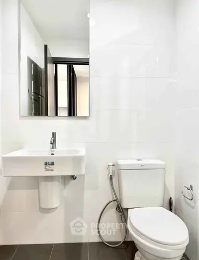 Modern bathroom with sleek fixtures and minimalist design, perfect for contemporary living.