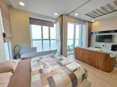 Luxurious corner unit with stunning ocean view, spacious living area, and modern decor in a high-rise apartment.